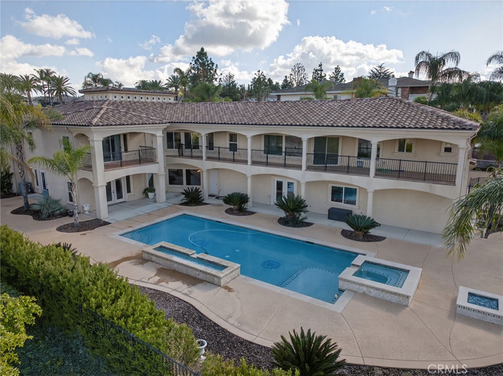 6959 Wyndham Hill Drive Riverside, CA 92506 - Photo 53 of 75 an aerial view of a house with swimming pool and furniture