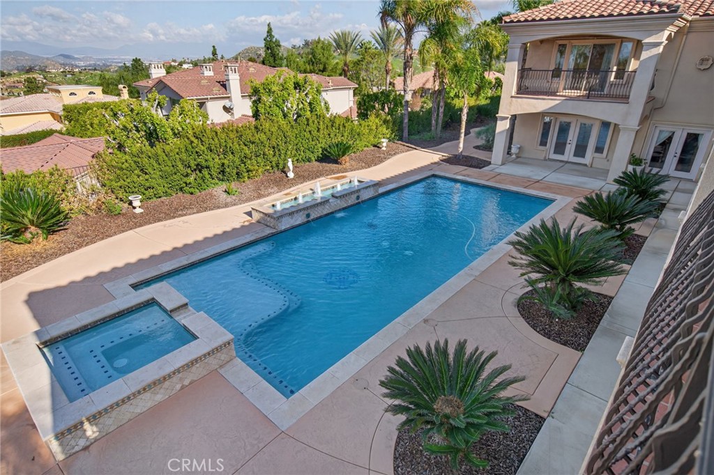 6959 Wyndham Hill Drive Riverside, CA 92506 - Photo 58 of 75 an outdoor view of the house with swimming pool