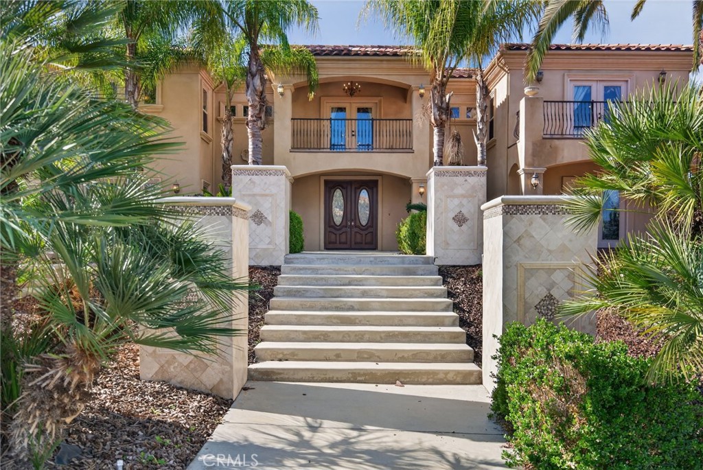 6959 Wyndham Hill Drive Riverside, CA 92506 - Photo 8 of 75 a front view of a house with a garden