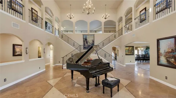 a view of a livingroom with furniture and staircase
