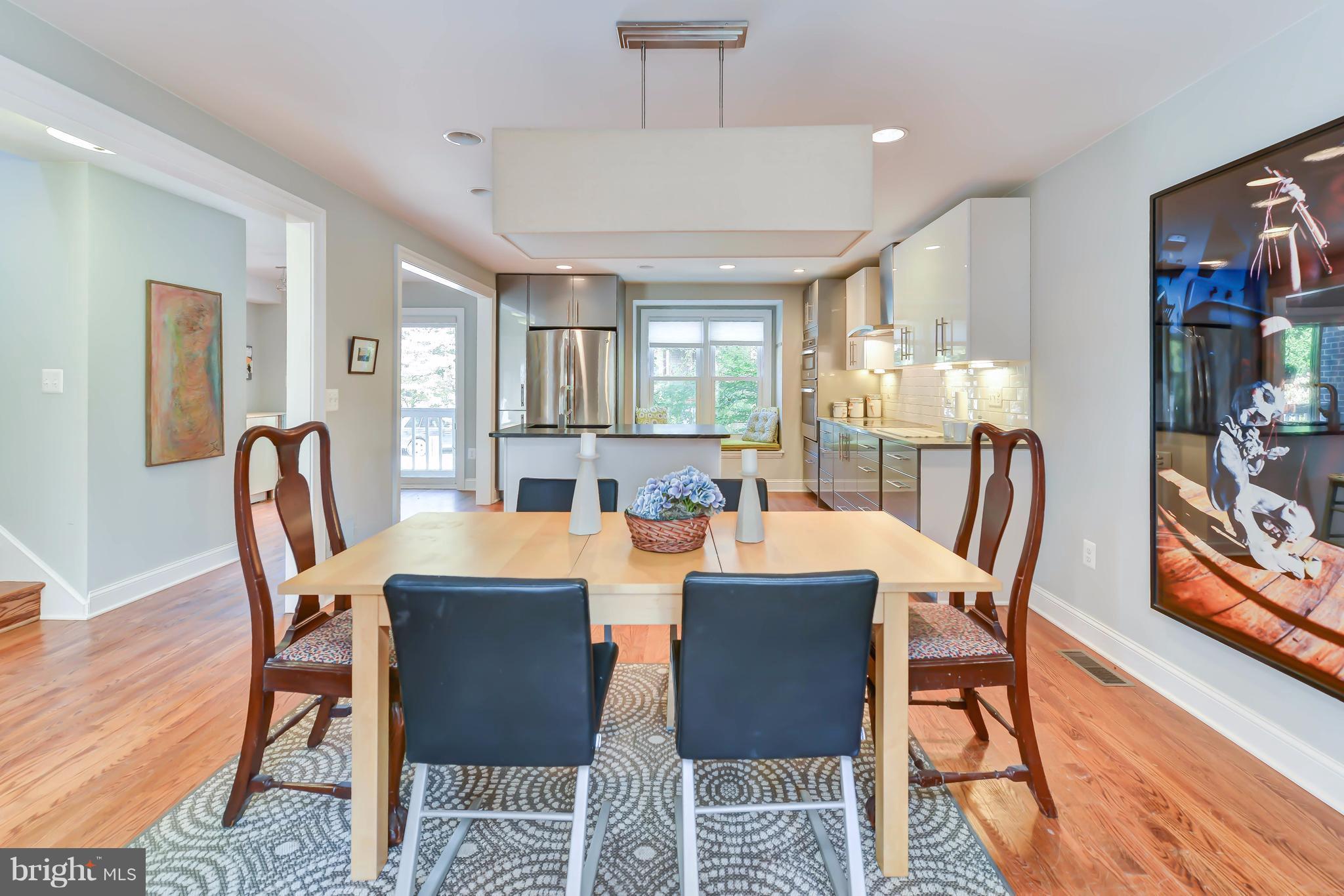2126 Military Road Arlington, VA 22207 - Photo 12 of 29 a view of a dining room with furniture window and wooden floor