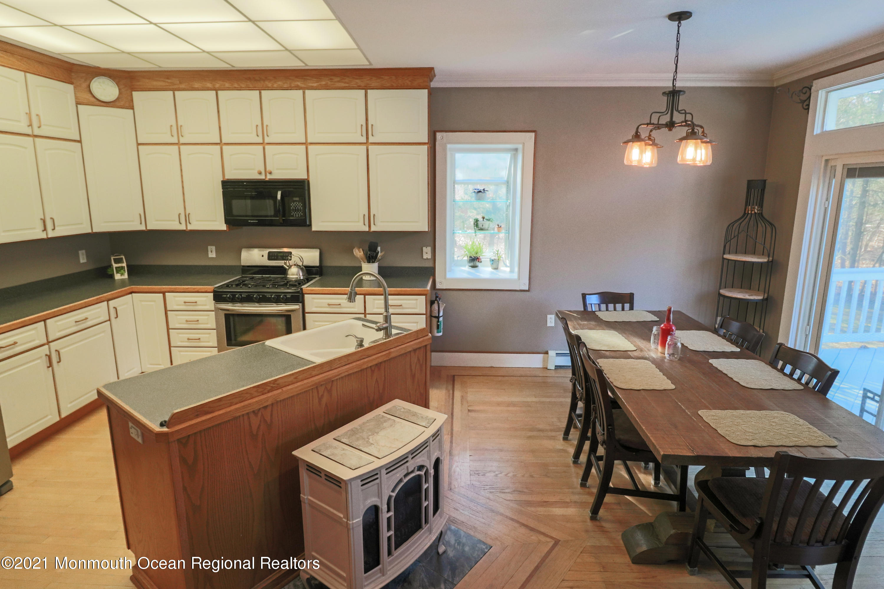 352 Brewers Bridge Road Jackson, NJ 08527 - Photo 18 of 34 a kitchen with stainless steel appliances granite countertop a sink a stove and a refrigerator