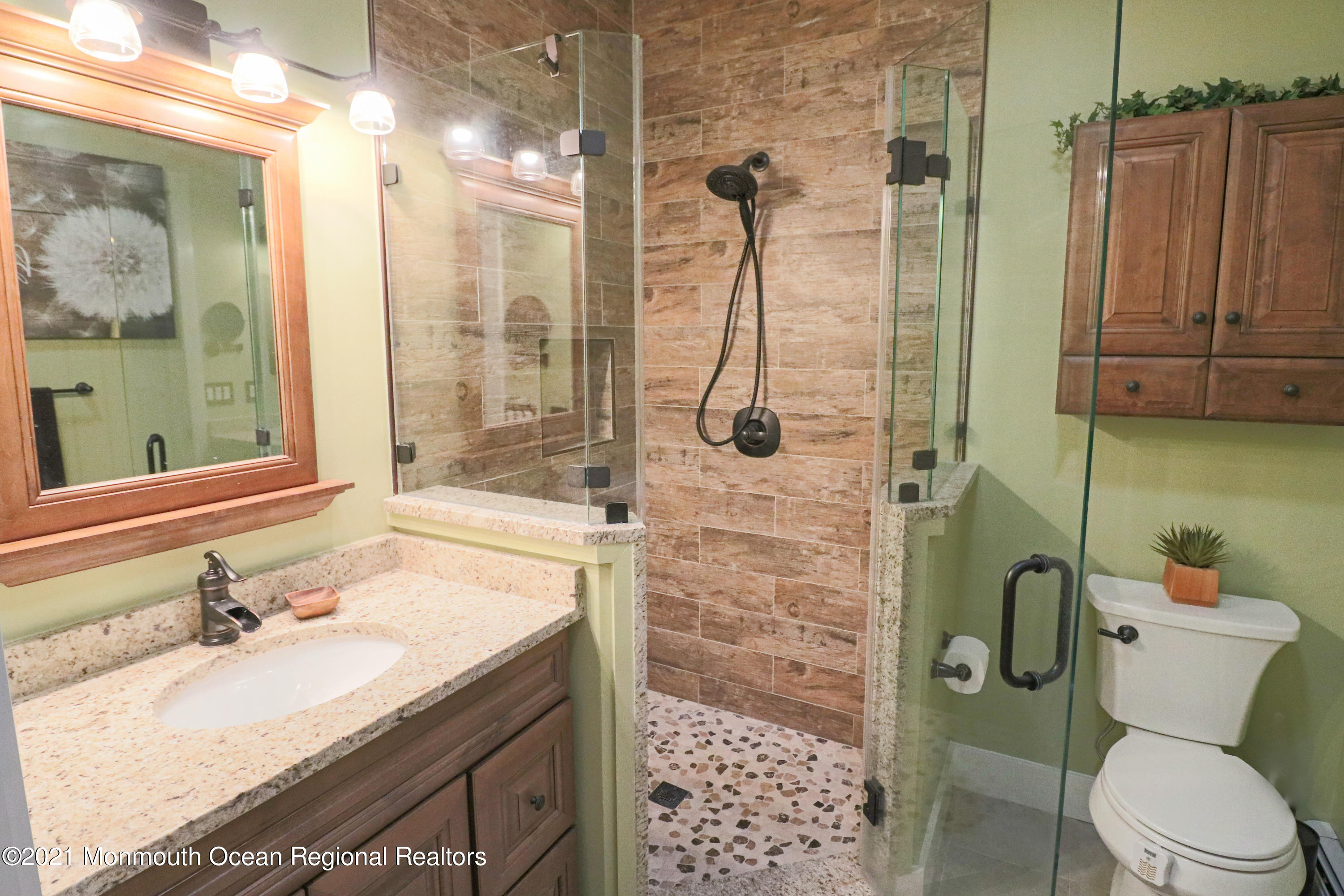 352 Brewers Bridge Road Jackson, NJ 08527 - Photo 25 of 34 a bathroom with a sink toilet vanity and shower