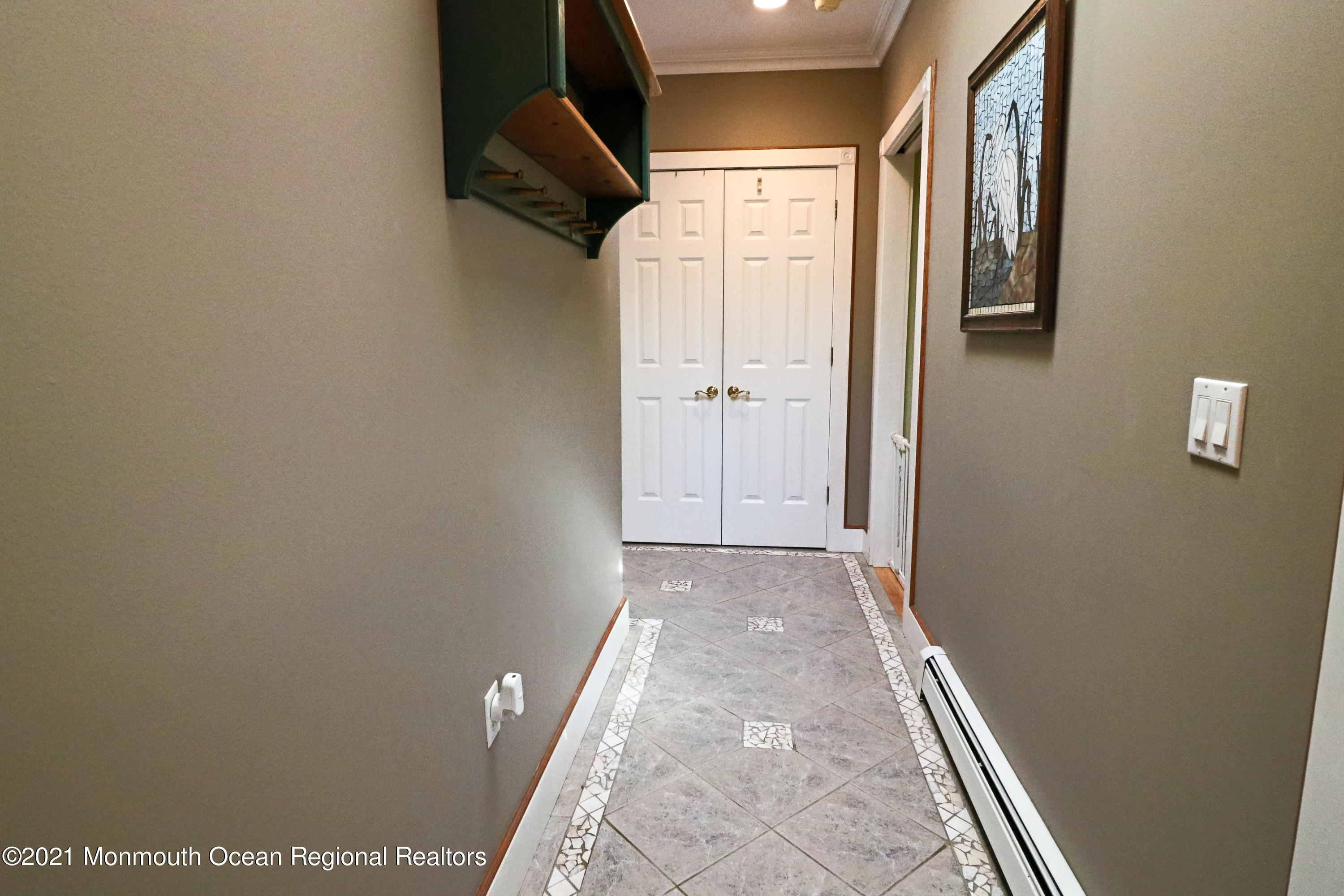 352 Brewers Bridge Road Jackson, NJ 08527 - Photo 26 of 34 a view of a hallway with wooden floor and a bathroom