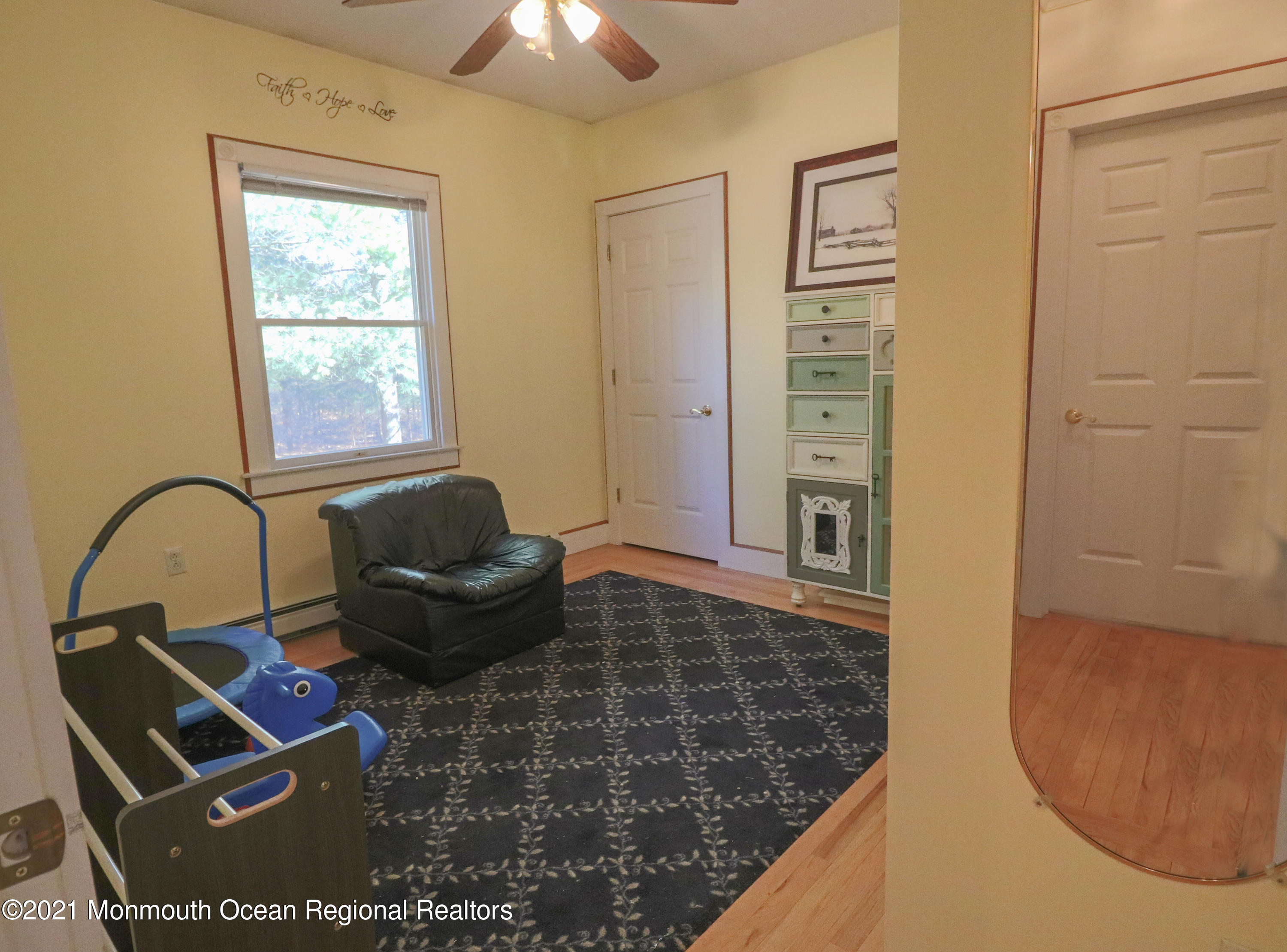 352 Brewers Bridge Road Jackson, NJ 08527 - Photo 28 of 34 a living room with furniture a window and a rug