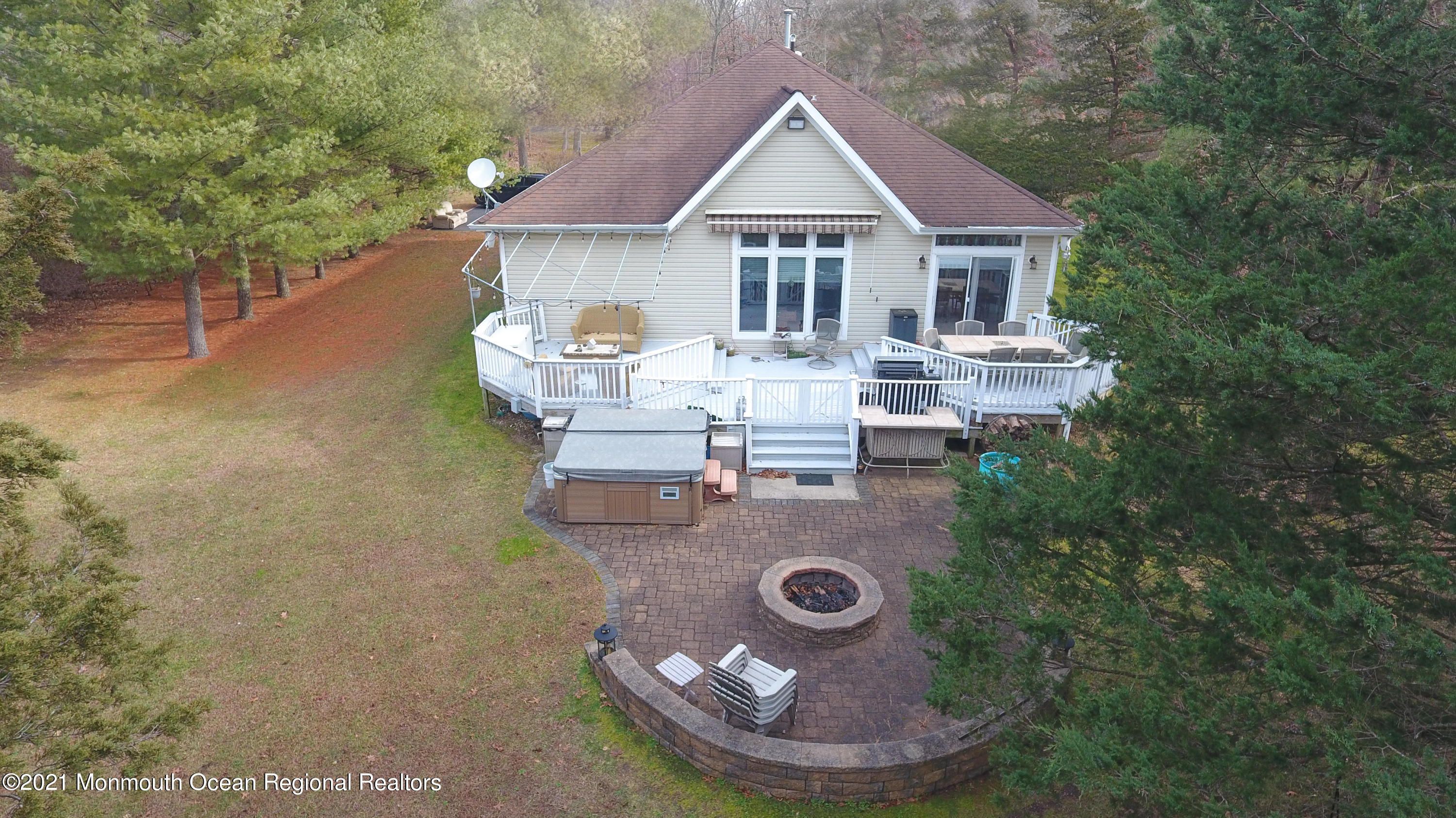 352 Brewers Bridge Road Jackson, NJ 08527 - Photo 9 of 34 a view of a house with backyard patio and fire pit