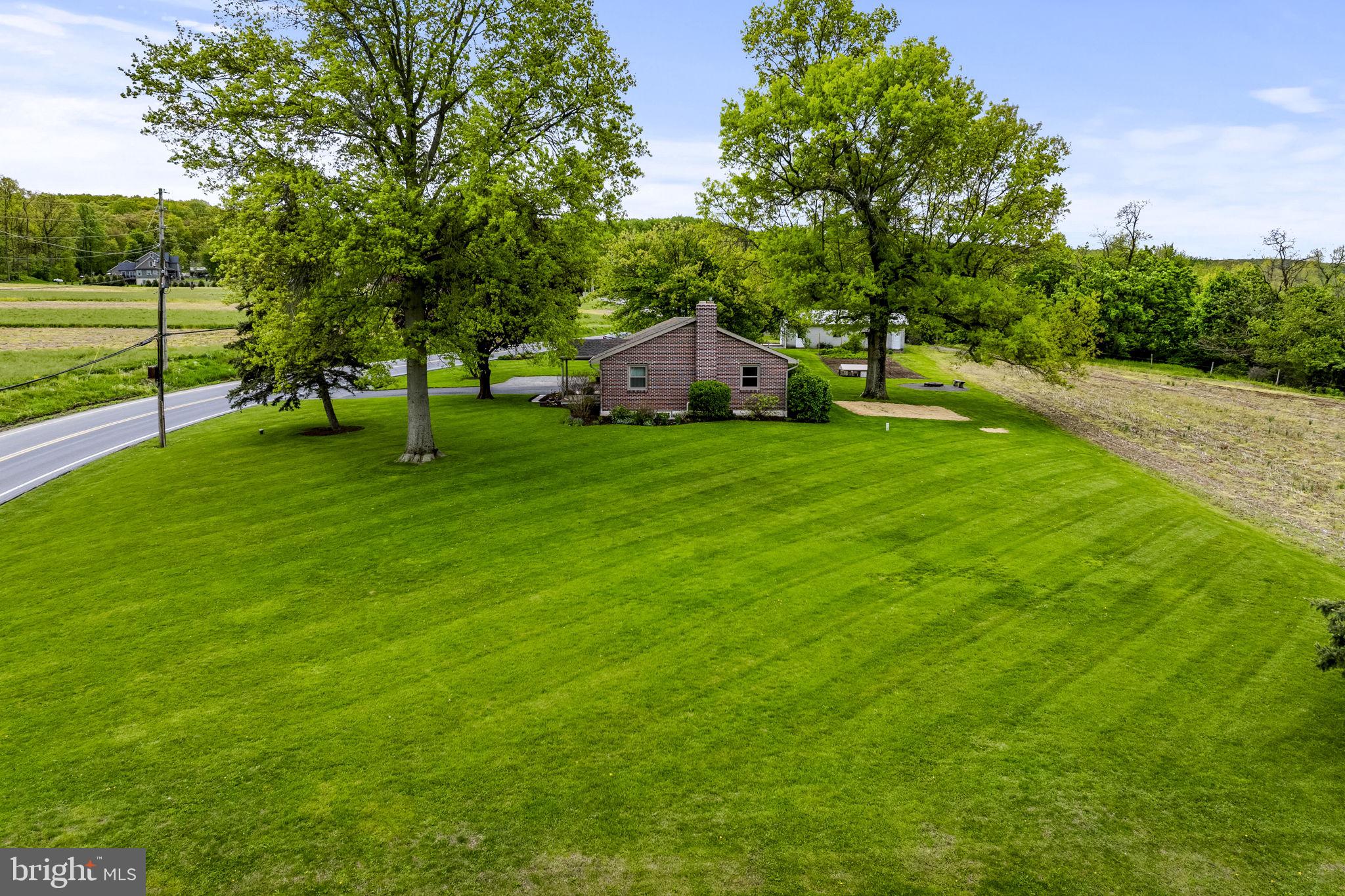 1160 Narvon Road Narvon, PA 17555 - Photo 9 of 64 a front view of a house with a yard and trees