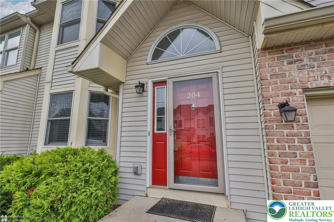 204 Ridings Circle Macungie, PA 18062 - Photo 2 of 53 a view of a brick house with large windows