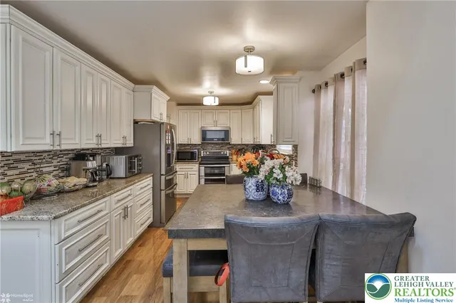 a kitchen with granite countertop lots of counter top space