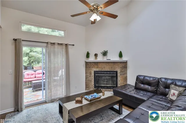 a living room with furniture and a fireplace