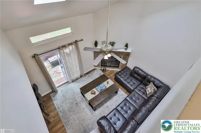 a living room with furniture and a rug