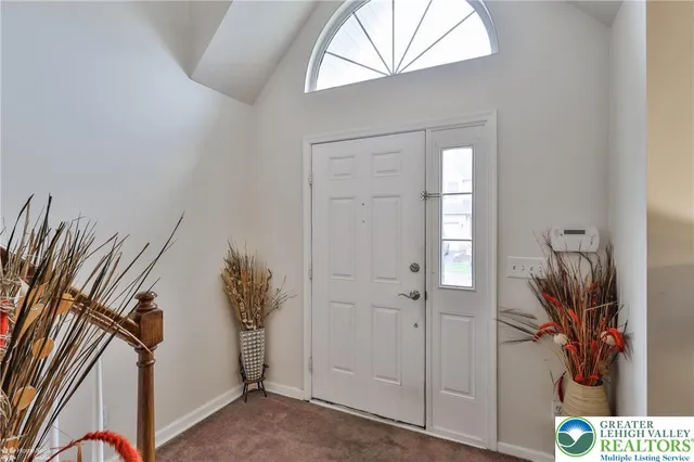 a view of an entryway with wooden floor