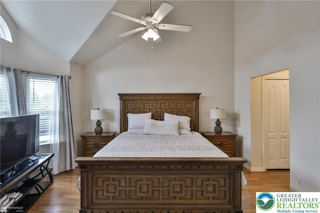 a bathroom with a shower a sink and mirror