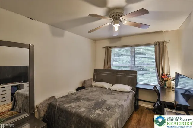 a bathroom with a sink mirror vanity and toilet