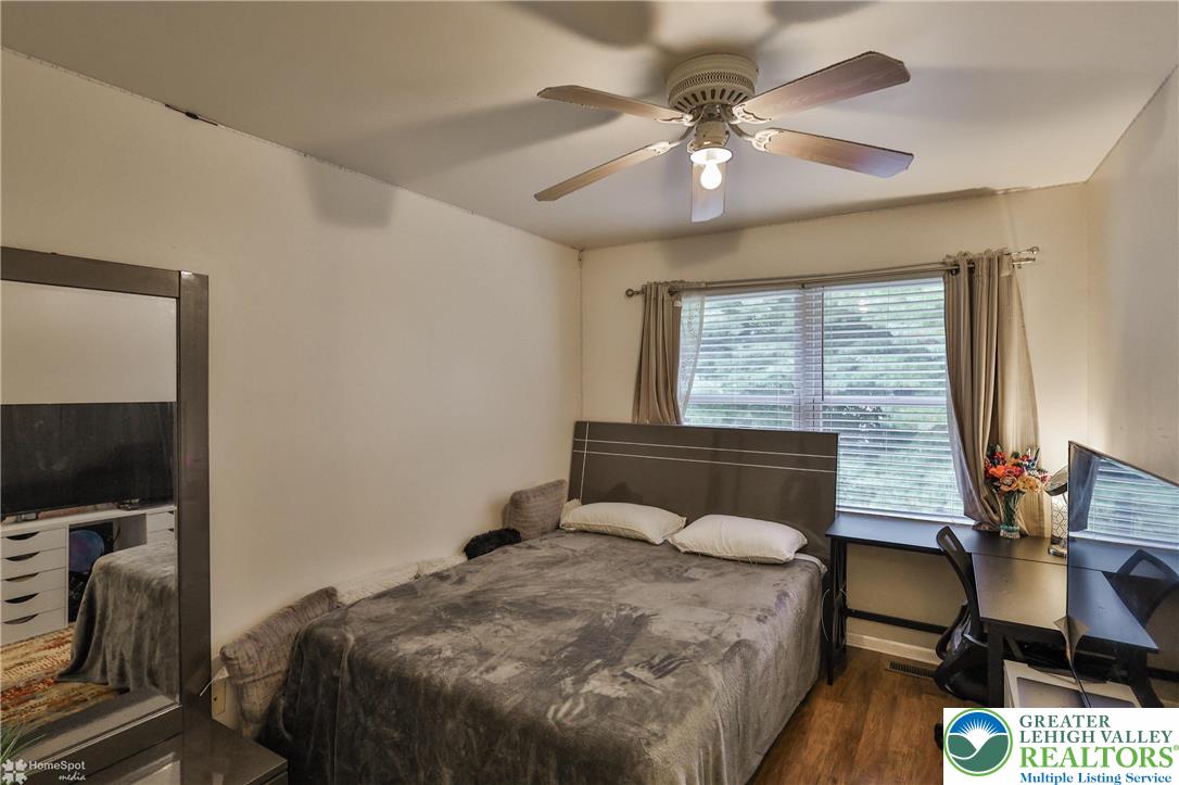 204 Ridings Circle Macungie, PA 18062 - Photo 37 of 53 a bedroom with a bed and a flat tv screen on dresser