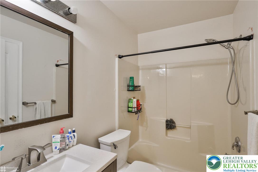 204 Ridings Circle Macungie, PA 18062 - Photo 39 of 53 a bathroom with a sink mirror vanity and toilet