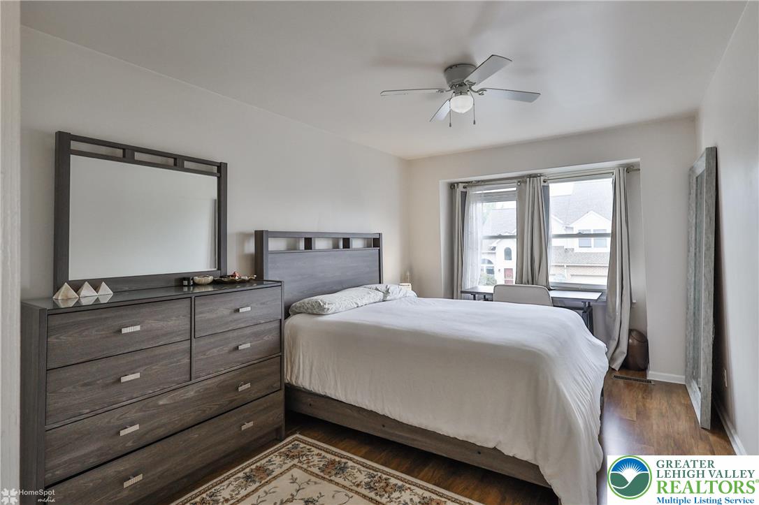 204 Ridings Circle Macungie, PA 18062 - Photo 40 of 53 a bedroom with a bed and a mirror on dresser