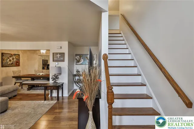 a view of entryway and hall with wooden floor