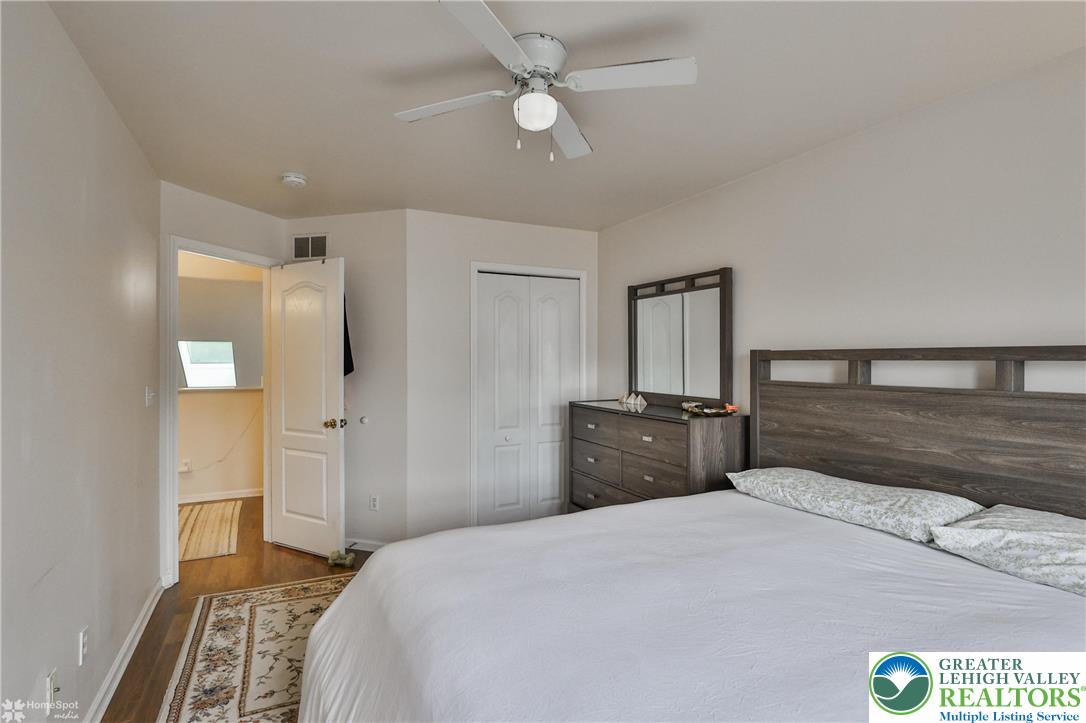 204 Ridings Circle Macungie, PA 18062 - Photo 41 of 53 a bedroom with a bed and a chandelier