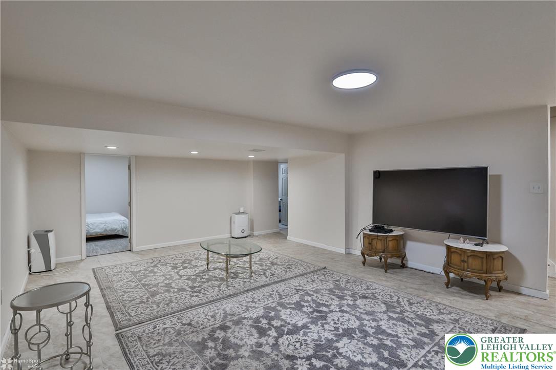 204 Ridings Circle Macungie, PA 18062 - Photo 43 of 53 a living room with furniture and a flat screen tv