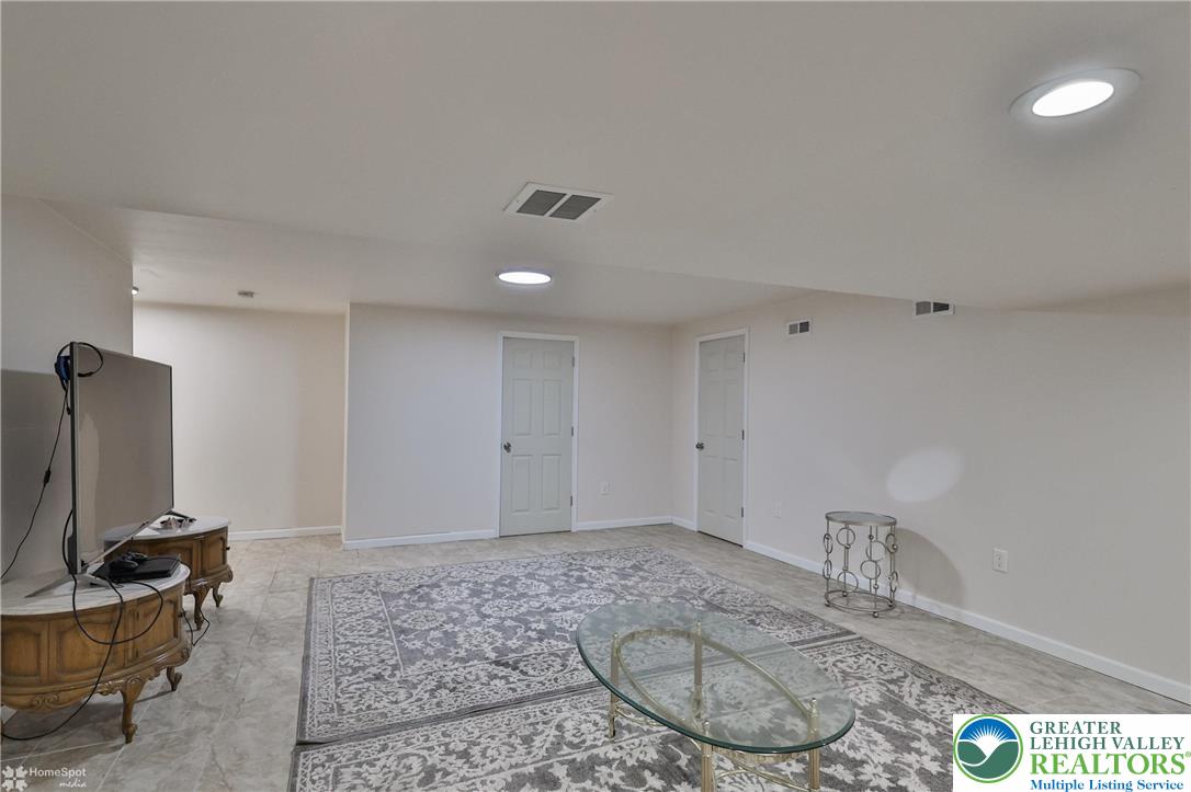 204 Ridings Circle Macungie, PA 18062 - Photo 44 of 53 a view of a livingroom with furniture and a flat screen tv