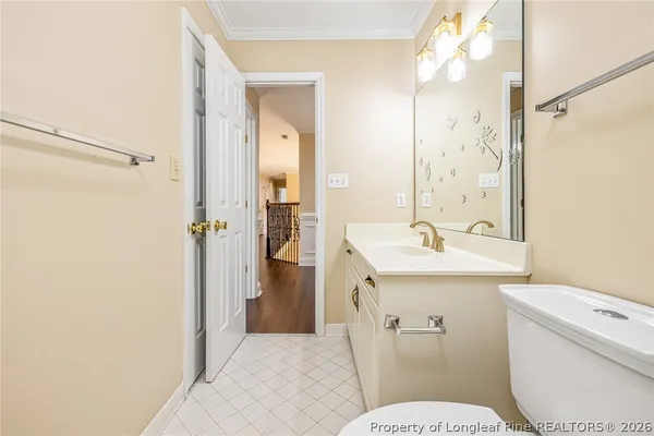 a bathroom with a sink a toilet a shower and a mirror