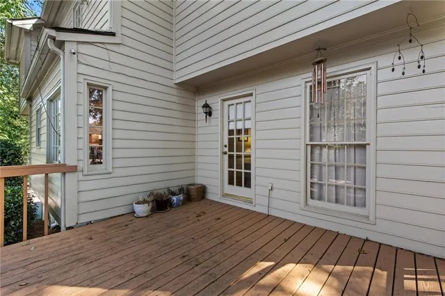 a view of a house with a yard and large tree