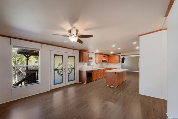 a large kitchen with a table and chairs in it