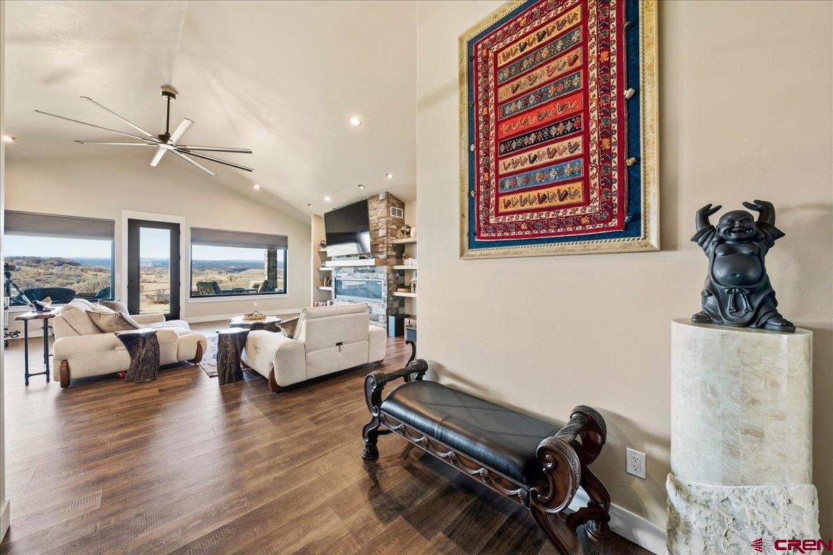 11266 5880 Road Montrose, CO 81403 - Photo 11 of 43 a living room with furniture and a wooden floor