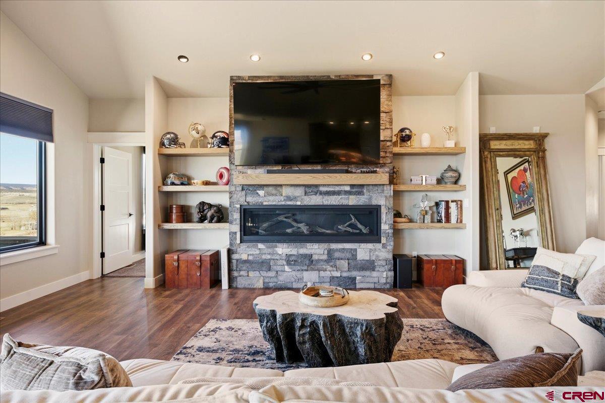 11266 5880 Road Montrose, CO 81403 - Photo 13 of 43 a living room with furniture and a flat screen tv