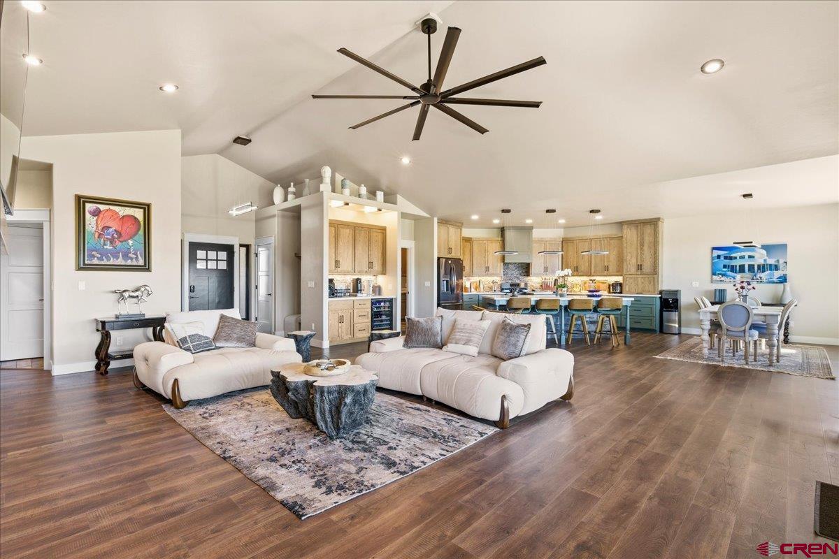 11266 5880 Road Montrose, CO 81403 - Photo 14 of 43 a living room with furniture kitchen view and a wooden floor