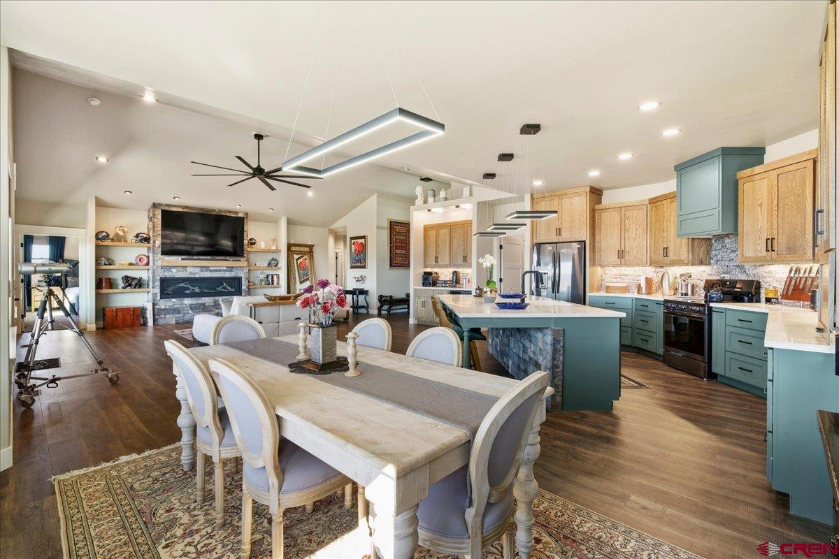 11266 5880 Road Montrose, CO 81403 - Photo 15 of 43 a large kitchen with a table and chairs