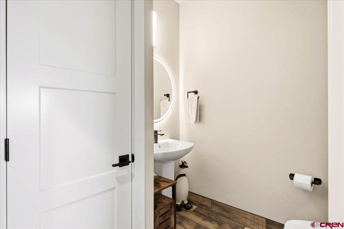 11266 5880 Road Montrose, CO 81403 - Photo 28 of 43 a bathroom with a sink and a mirror