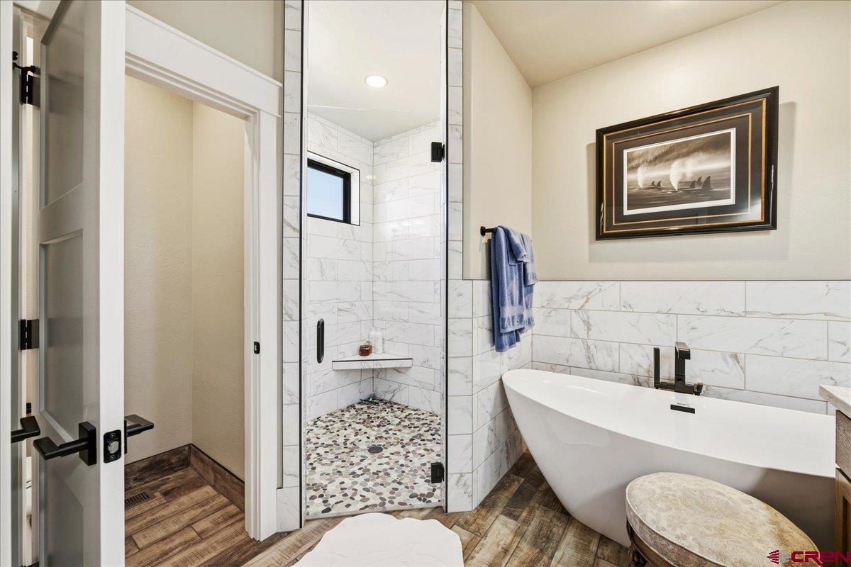 11266 5880 Road Montrose, CO 81403 - Photo 31 of 43 a bathroom with a sink toilet and shower