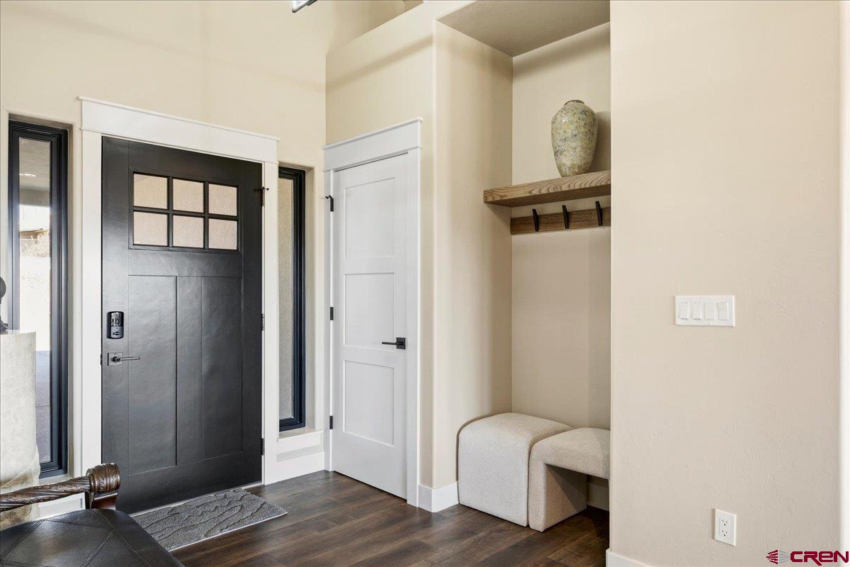 11266 5880 Road Montrose, CO 81403 - Photo 10 of 43 a view of a hallway with wooden floor and closet