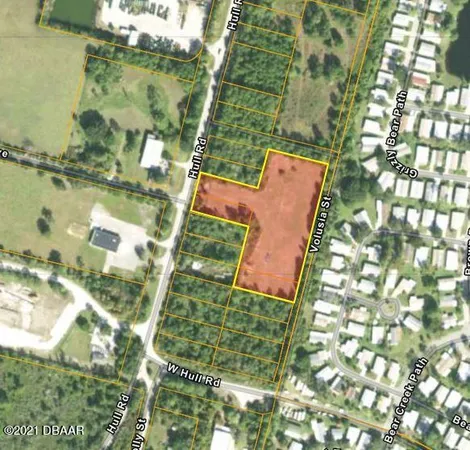 an aerial view of houses with yard
