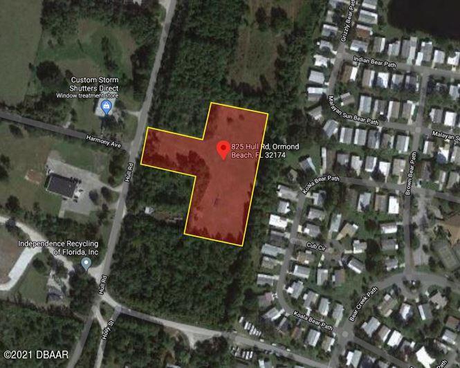 825 Hull Road Ormond Beach, FL 32174 - Photo 19 of 32 an aerial view of a house with swimming pool and outdoor space