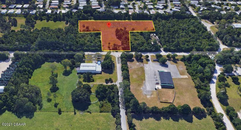 825 Hull Road Ormond Beach, FL 32174 - Photo 22 of 32 an aerial view of houses with yard