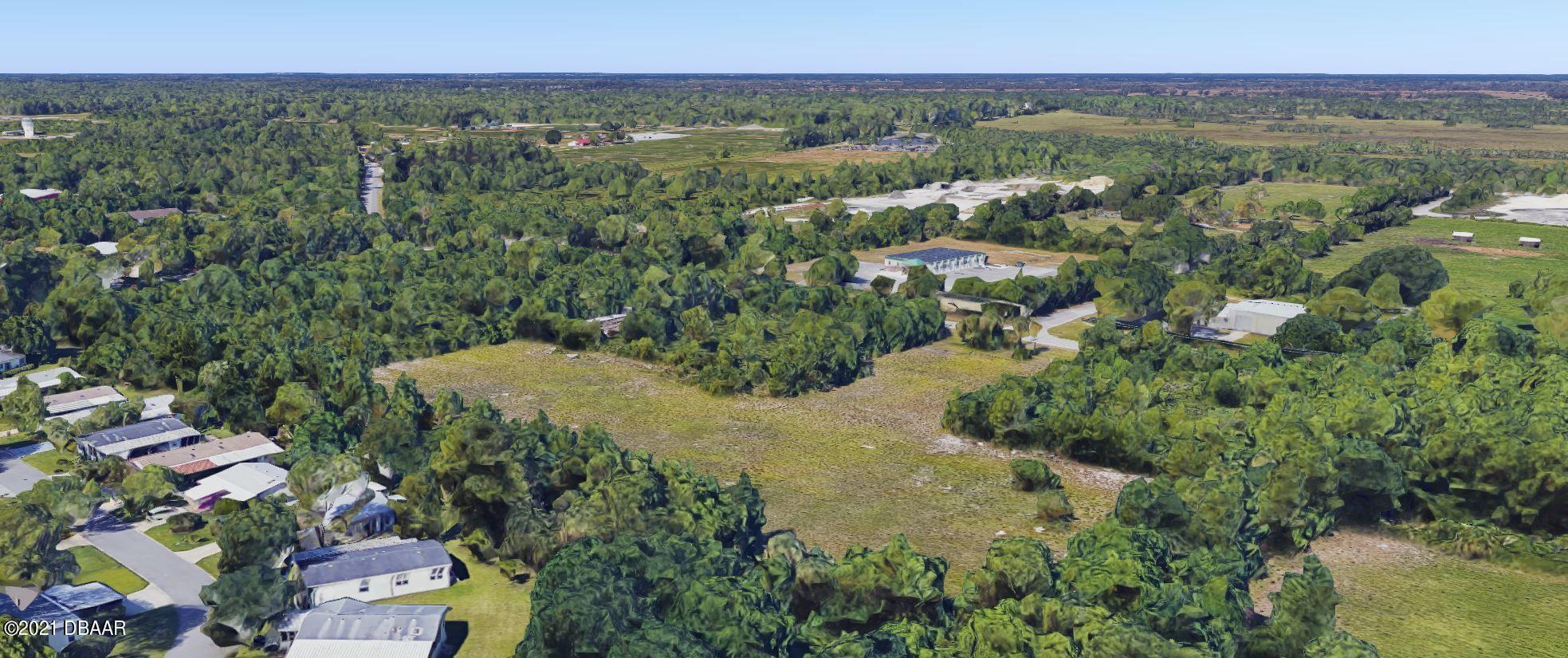 825 Hull Road Ormond Beach, FL 32174 - Photo 29 of 32 an aerial view of a house with a yard