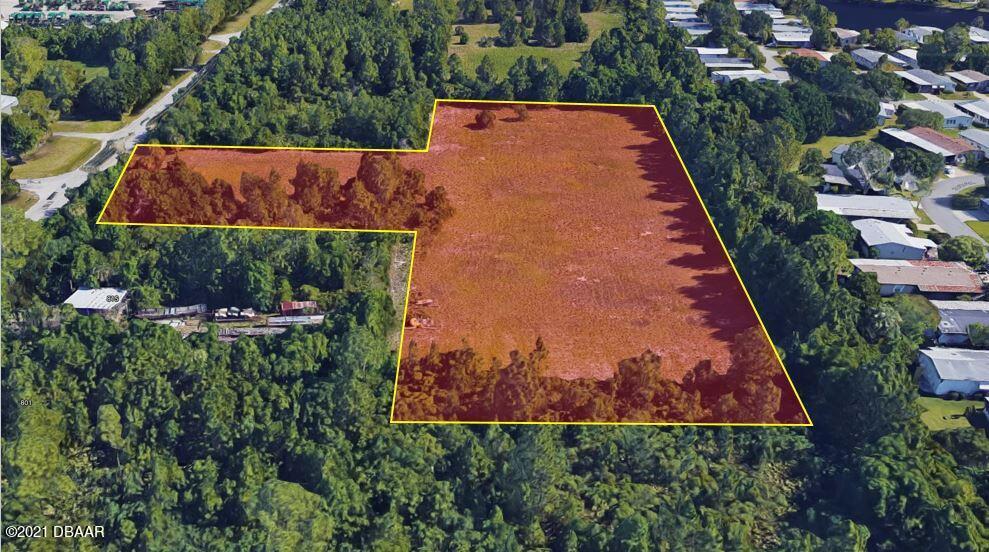 825 Hull Road Ormond Beach, FL 32174 - Photo 6 of 32 an aerial view of house with yard