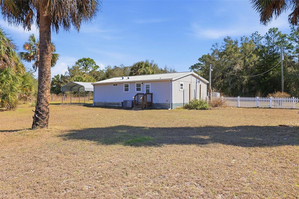 9510 North Eventide Point Crystal River, FL 34428 - Photo 11 of 45 a view of a house with a yard