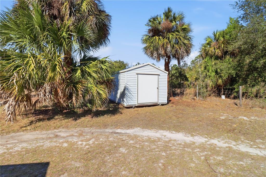 9510 North Eventide Point Crystal River, FL 34428 - Photo 12 of 45 a view of a house with a yard and plant