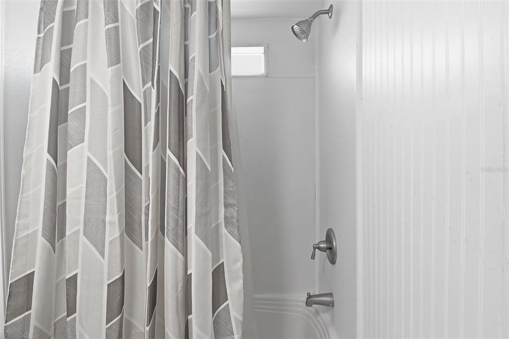 9510 North Eventide Point Crystal River, FL 34428 - Photo 39 of 45 a bathroom with a shower curtain and a shower curtain