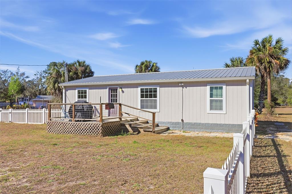 9510 North Eventide Point Crystal River, FL 34428 - Photo 43 of 45 a front view of house with yard outdoor seating and barbeque oven