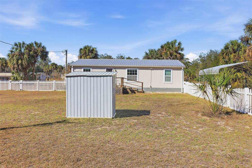 9510 North Eventide Point Crystal River, FL 34428 - Photo 8 of 45 a view of a house with a backyard