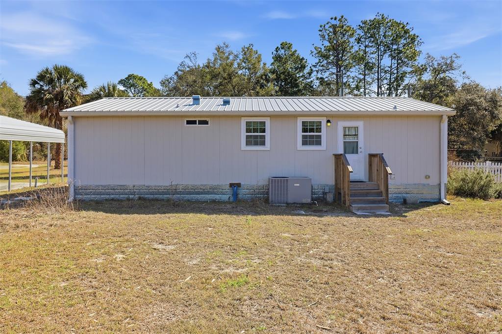 9510 North Eventide Point Crystal River, FL 34428 - Photo 9 of 45 a view of a house with a yard