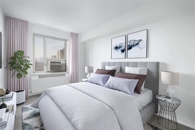 a bedroom with a bed and a window