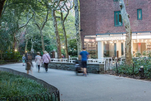 a view of a patio with couches and table and chairs and potted plants