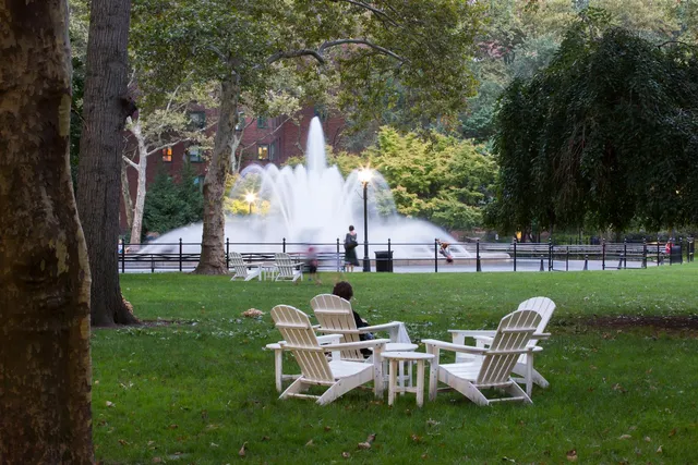 a view of a table and chairs in the garden