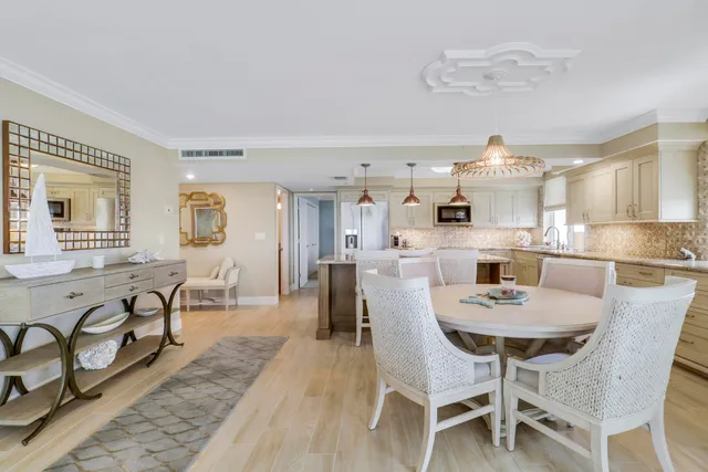 a bedroom with a large bed and a flat tv screen on dresser